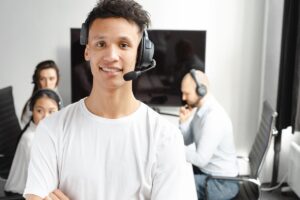 Call center agents with headsets working on a cloud phone system